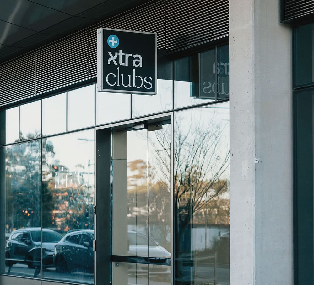 The XtraClubs shopfront, its sign above the glass doors
